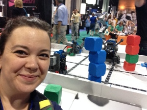 Here I am triumphant with my 4 cube tower that I built with a robot at the @vex robotics booth.